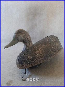 Vintage Carved Black Duck Decoy branded R E from Wisconsin area